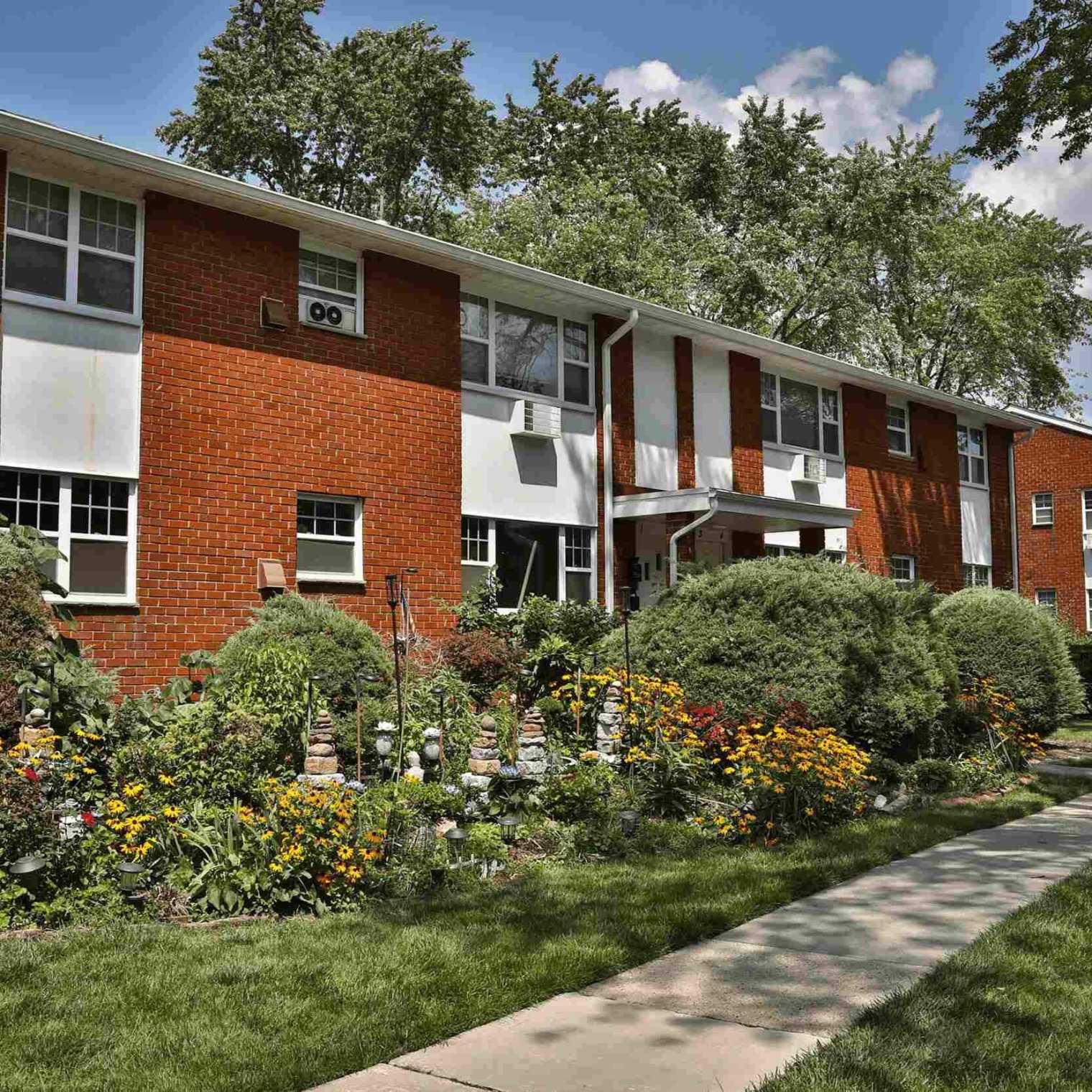 patridgerunapartments community building sidewalk garden